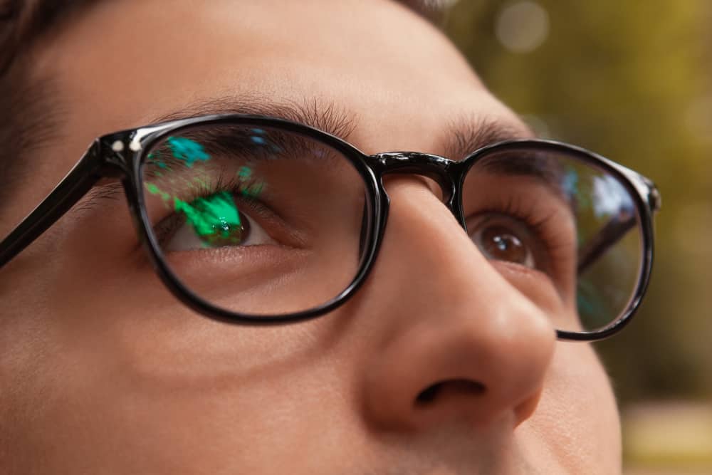 This is a close look at a man wearing a pair of glasses.