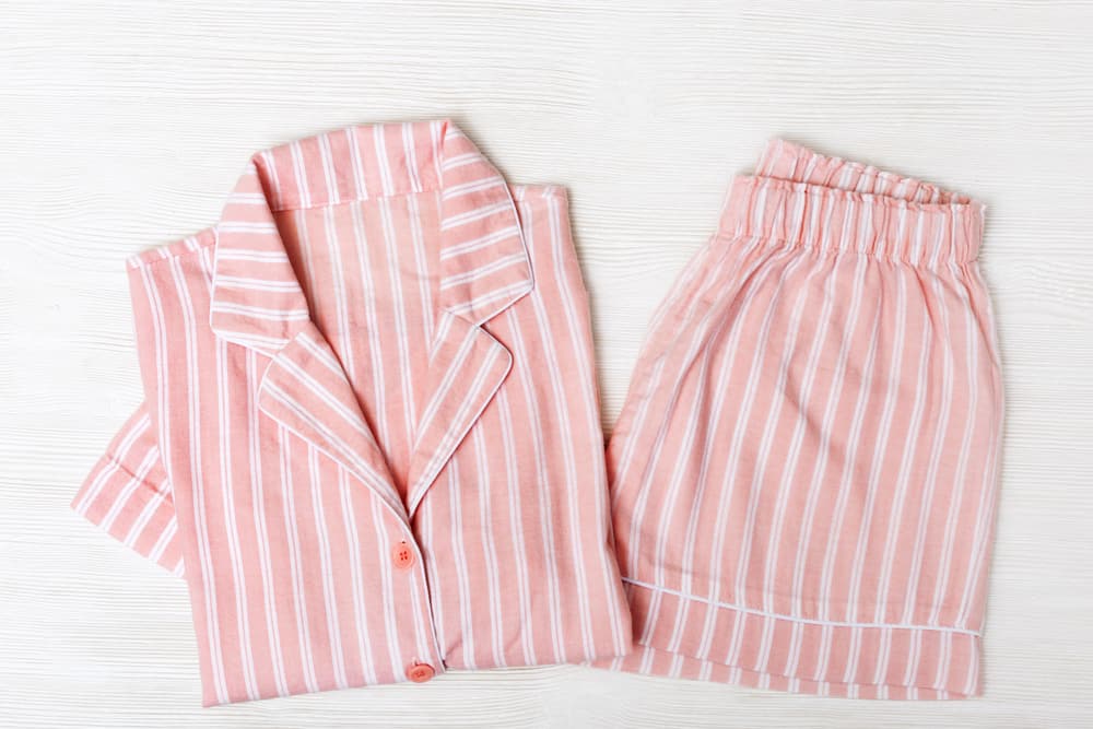 This is a close look at a set of peach striped classic pajamas.