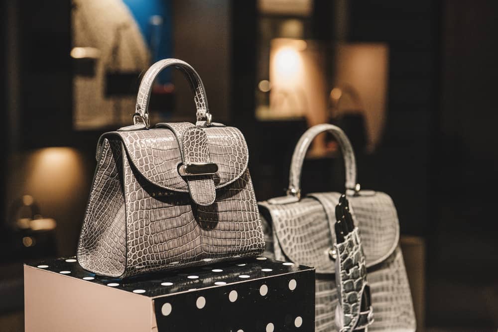 This is a close look at a couple of hand bags on display at a store.