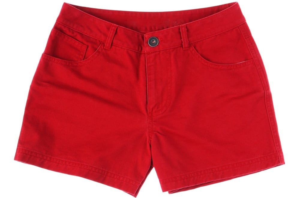 This is a close look at a pair of red jean shorts.