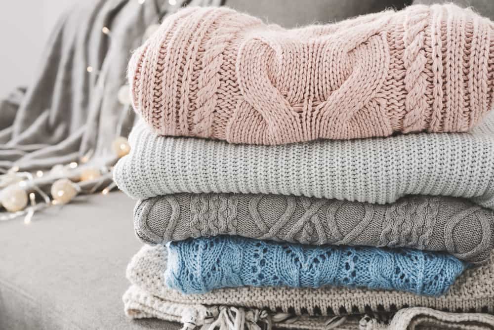 This is a close look at folded and stacked cashmere sweaters.
