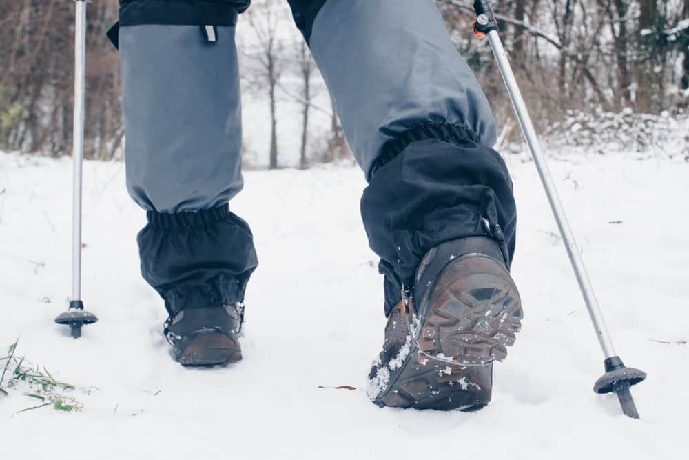 This is a close look at a snow hiker wearing a pair of gaiters.