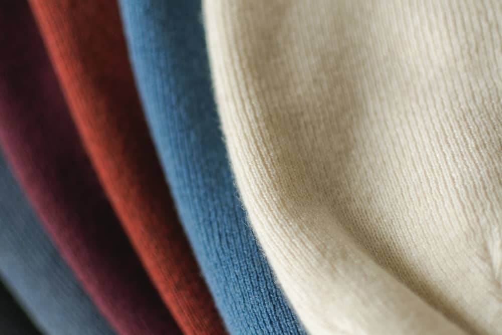 A close look at a variety of colorful cashmere hats.