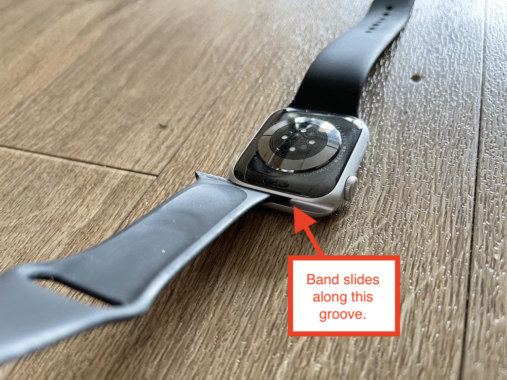 Apple Watch band slides in groove for release or putting on
