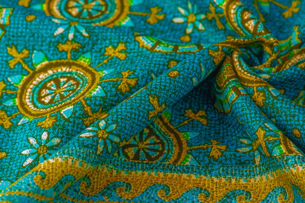 This is a piece of colorful and patterned charmeuse silk cloth.