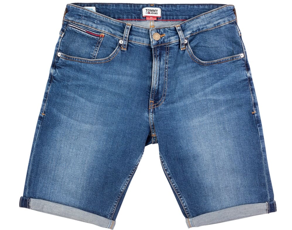 This is a close look at a pair of long denim shorts with cuffs.
