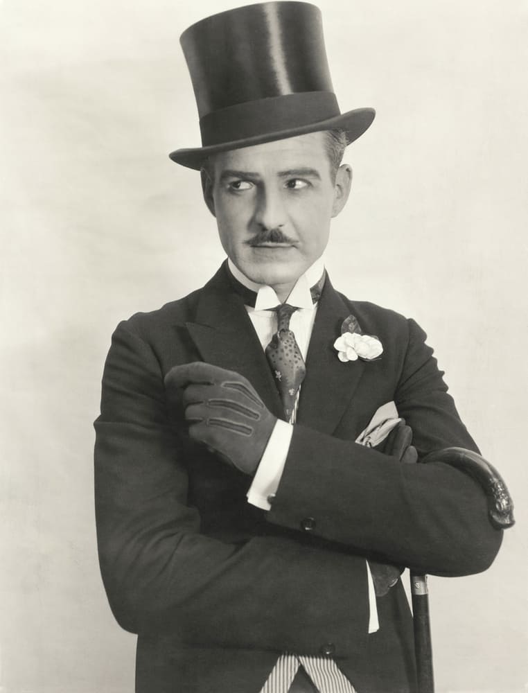This is a vintage photo of a gentleman wearing a top hat.