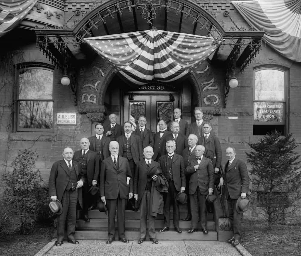 Wayne Bidwell Wheeler with a group of men standing on the steps of the Washington Headquarters of the National Woman's Christian Temperance.