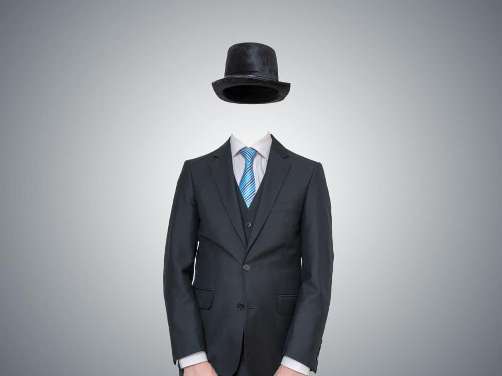 An invisible man wearing a full suit and a matching black bowler hat.
