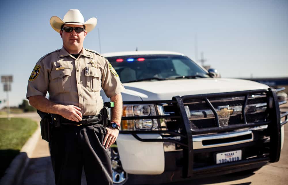A Texas Police Officer with his truck.