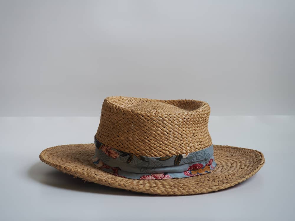 Toquilla straw hat with blue fabric strap.