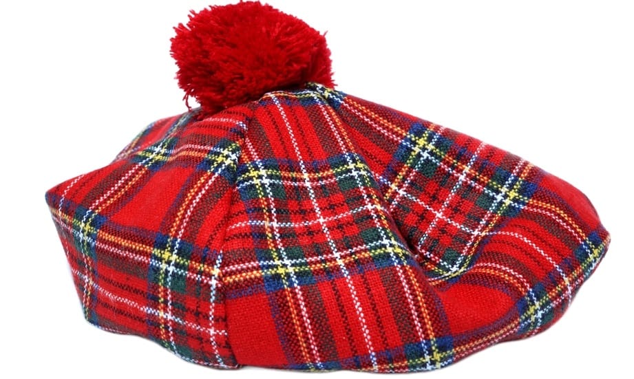 This is a traditional Irish tartan bonnet with checkered pattern and pompom.