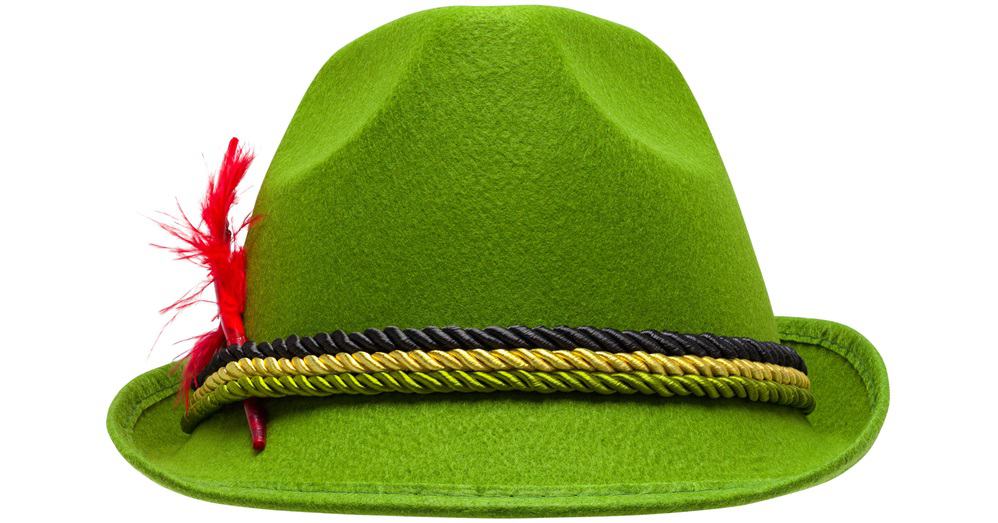 This is a close look at a green Bavarian tylorean hat with a feather on the side.