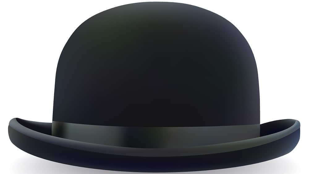 A close look at a black bowler hat with a black band.
