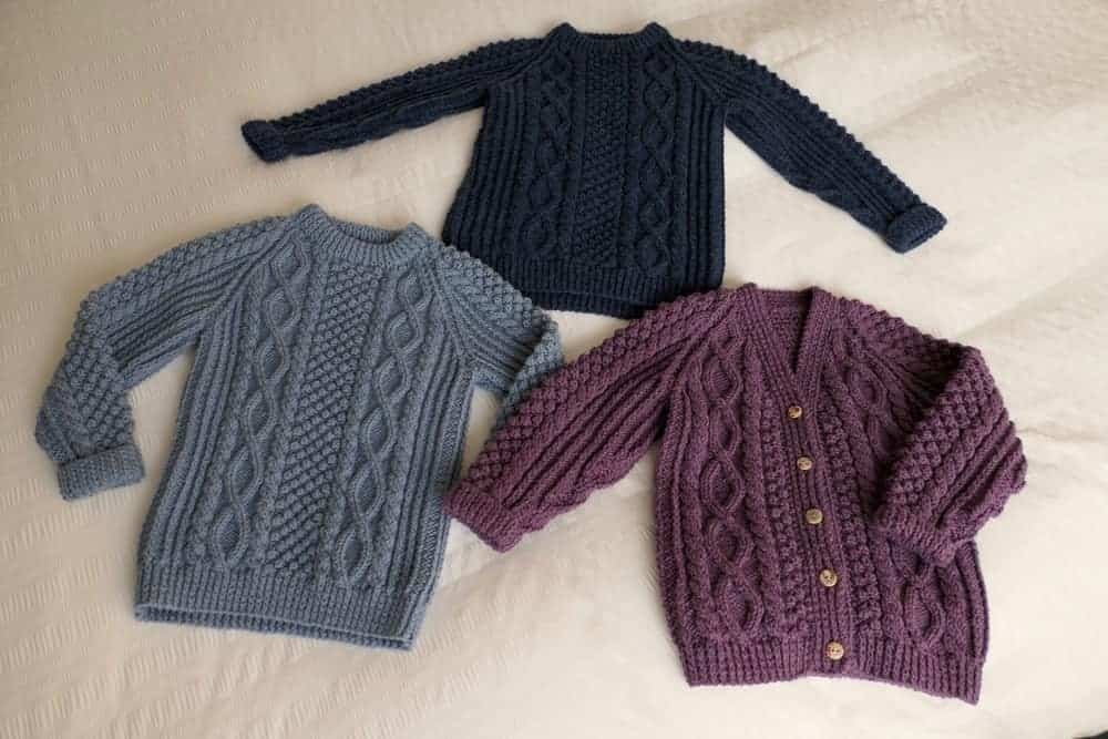 Multicolored cable knit sweaters