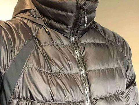 A close look at a black zipped-up Canada Goose jacket.