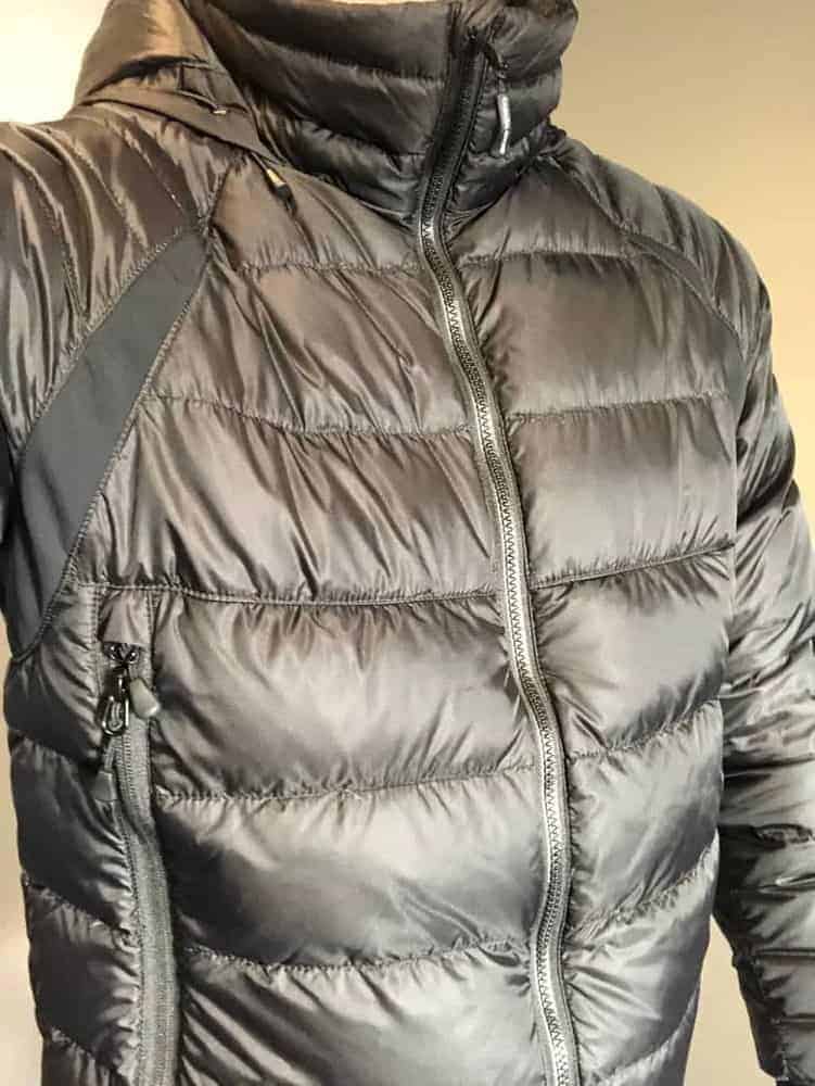 Wearing a black Canada Goose down jacket.