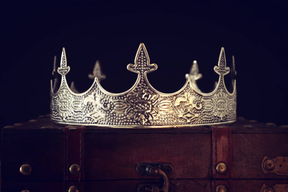 Vintage crown on a wooden chest.