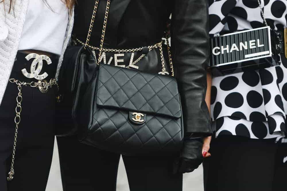 Women wearing Chanel purses.