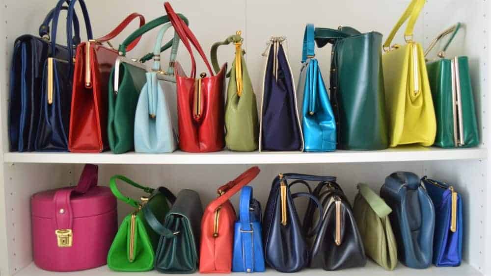 Handbag collection on shelves.