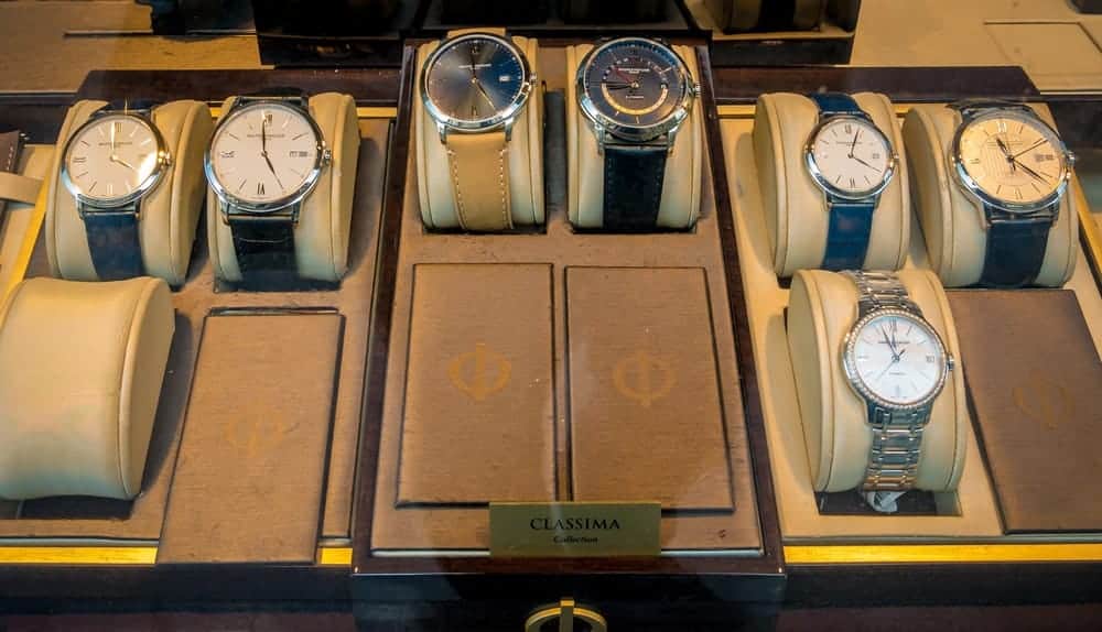 A variety of wristwatches on display at a store.