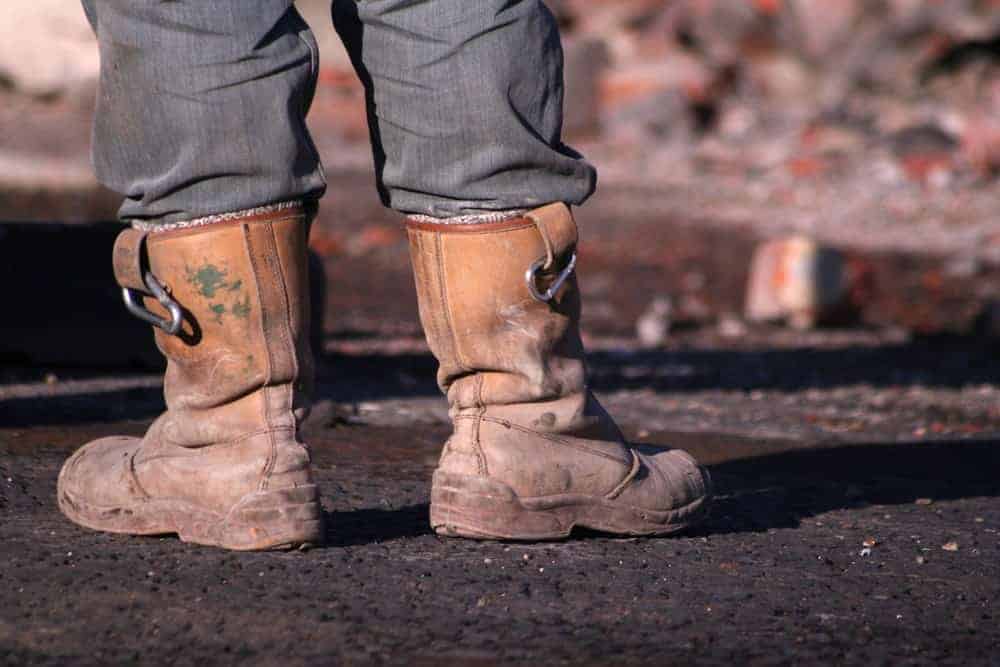 A workman wearing rigger boots.