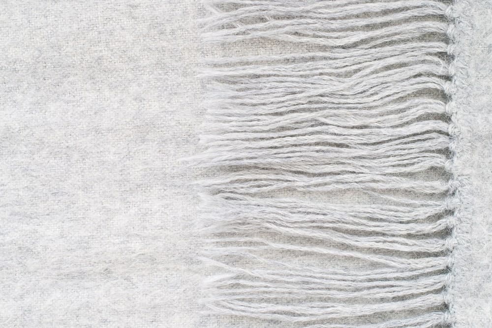 A close look at a gray alpaca wool scarf.