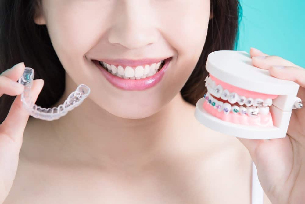 A woman making a choice between having braces or something simpler.