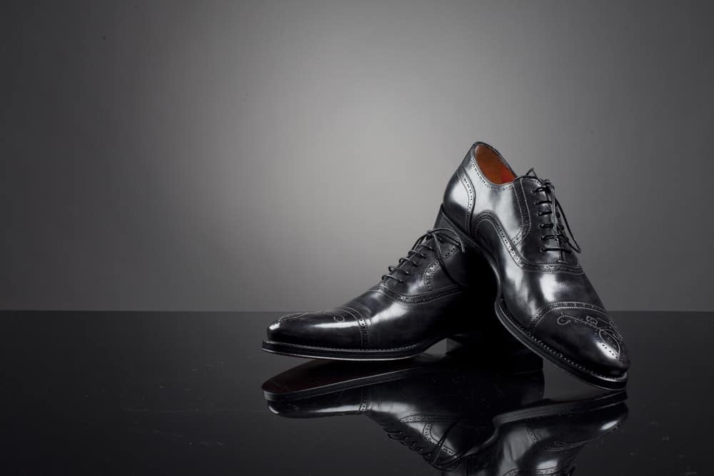 A pair of expensive black leather shoes for men.