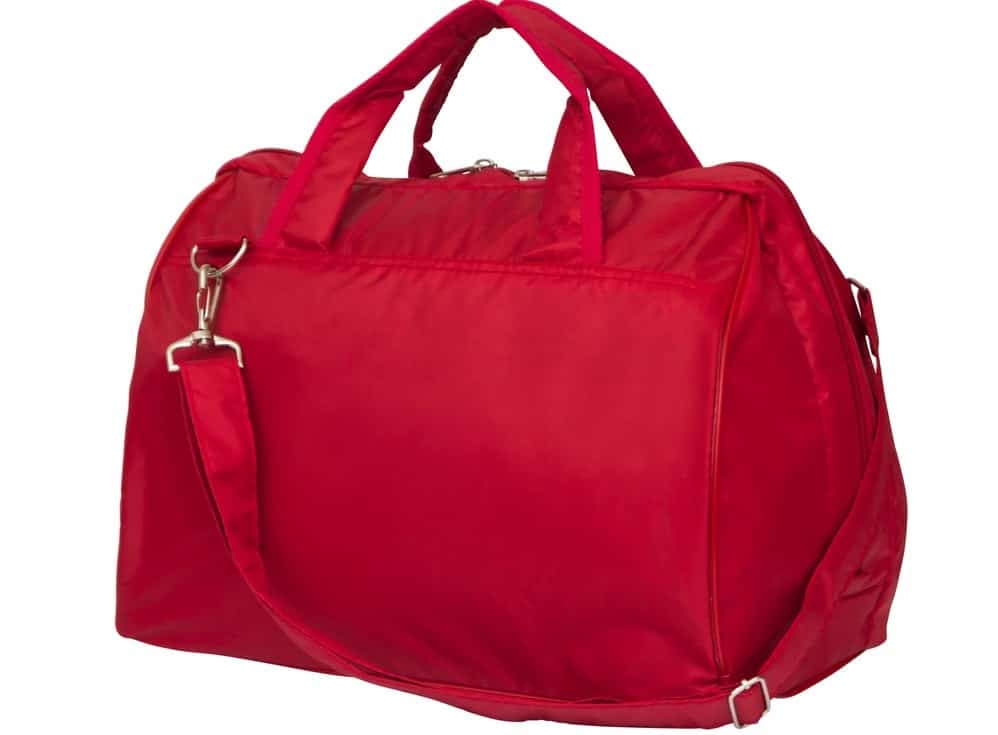 A close look at a red duffel bag.