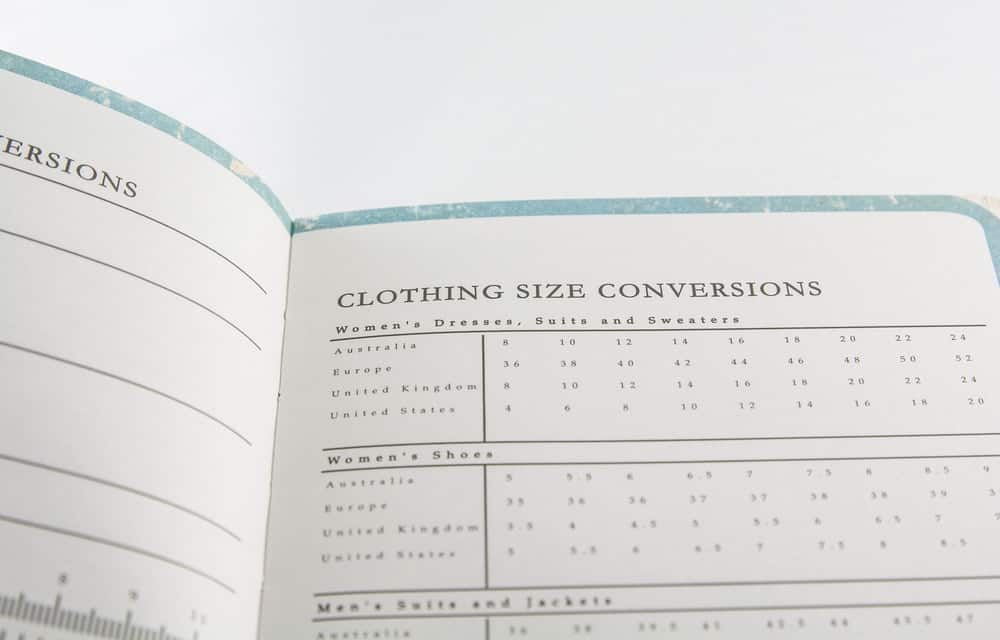 A close look at a page of a book showing clothing size conversions.