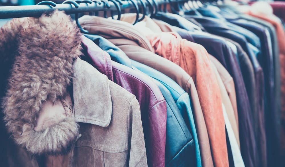 A rack of different coats.