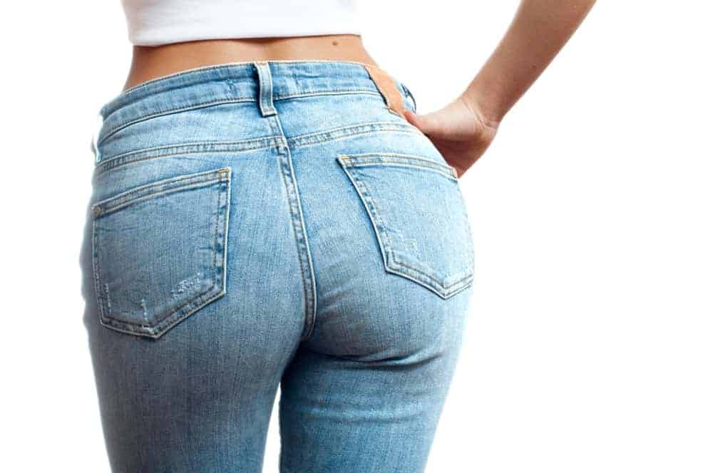A close look at a woman wearing a pair of jeans.
