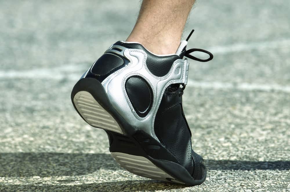 Photo of a foot wearing basketball shoe.