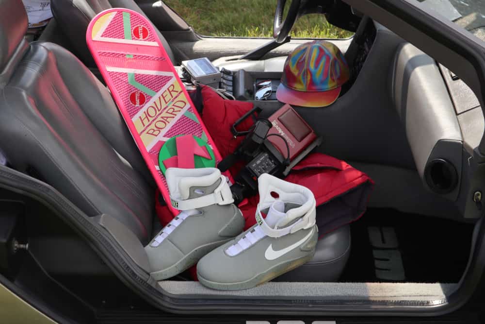Nike Air Mag boots along with Hover Board and Sony video cam inside a car.