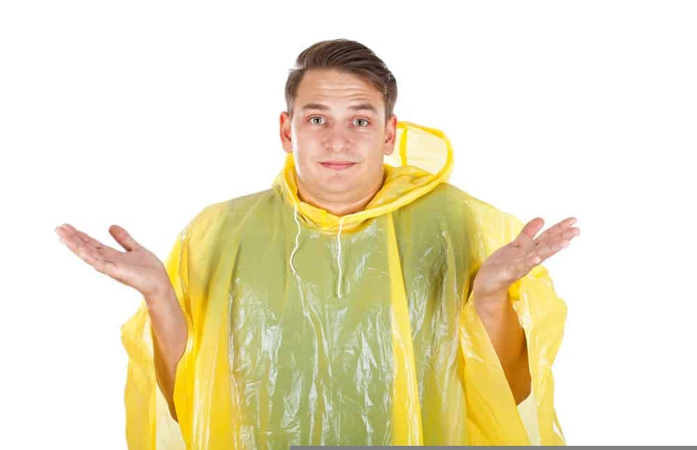 A man wearing a yellow water-resistant coat.