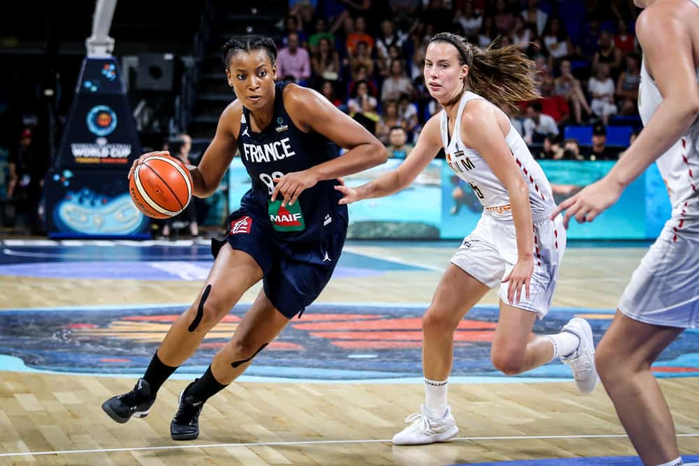 Basketball players Diandra Tchatchouang and Antonia Delaere in action during a basketball match.