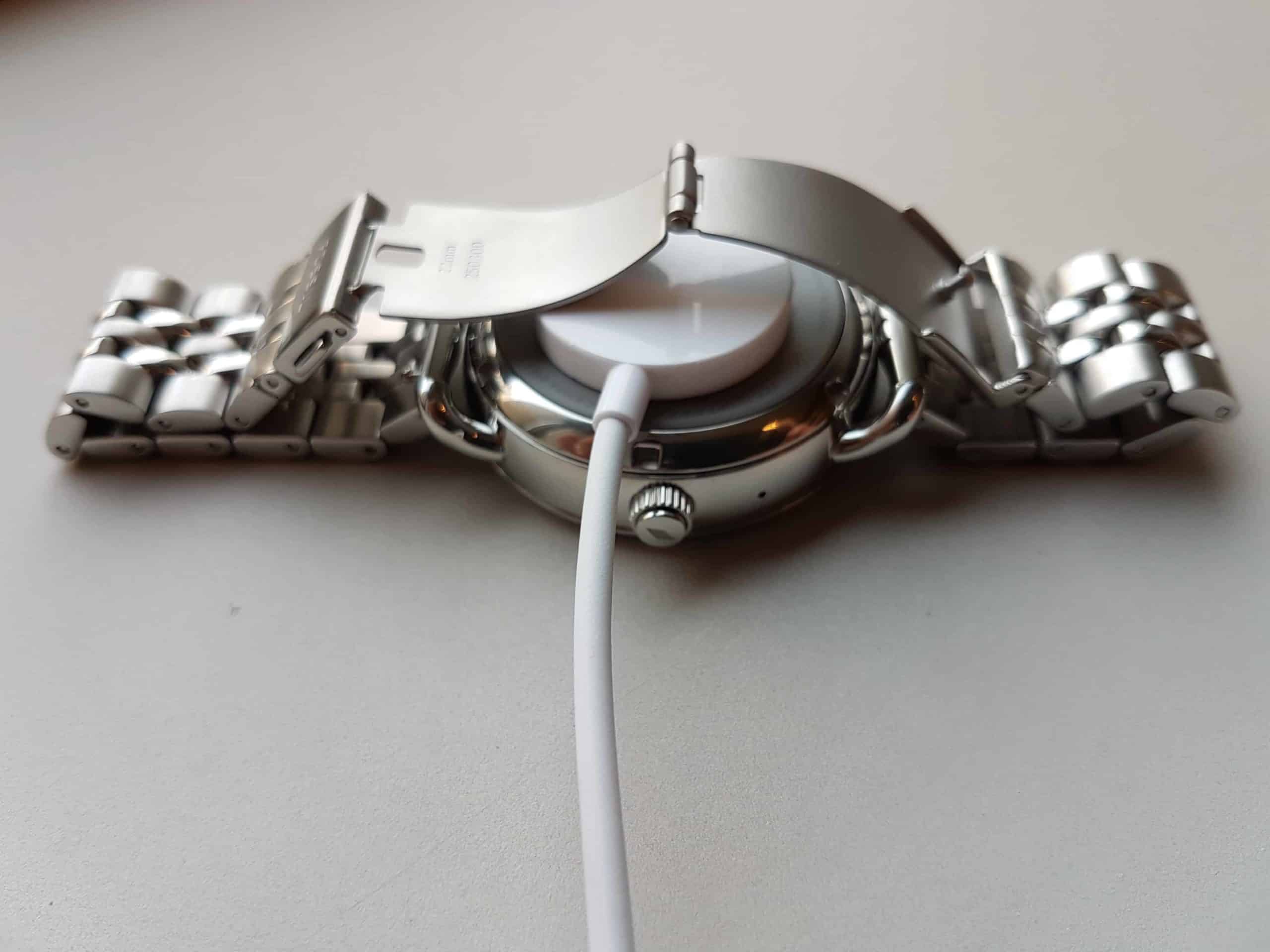 A Fossil Q smartwatch with connected charger.