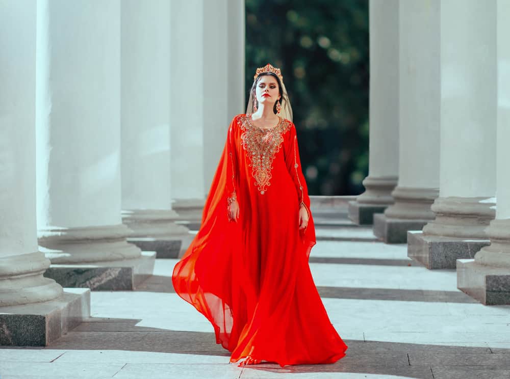 Woman wearing a red harem dress.