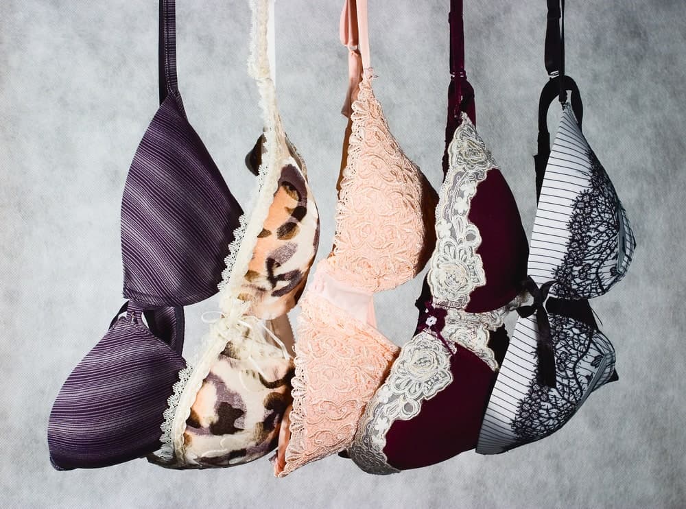 A row of colorful patterned bras.