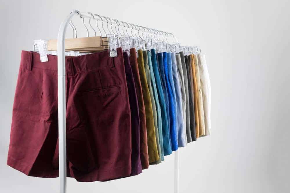 Pairs of chino shorts on display at a rack.