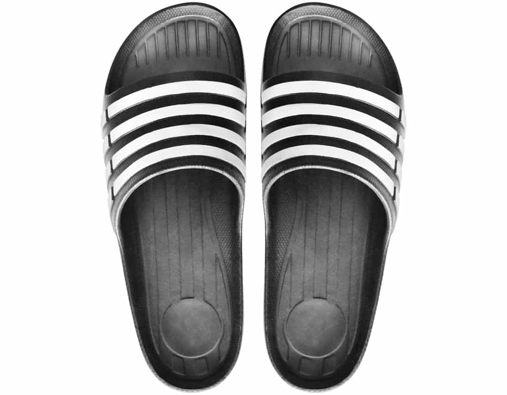 A pair of black and white rubber sandals.