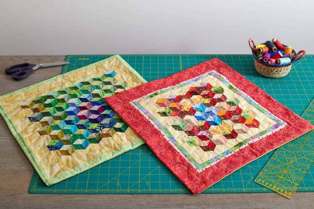 A close look at a couple of colorful miniature quilts.