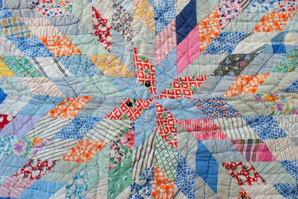 A colorful patchwork quilt with patterns.