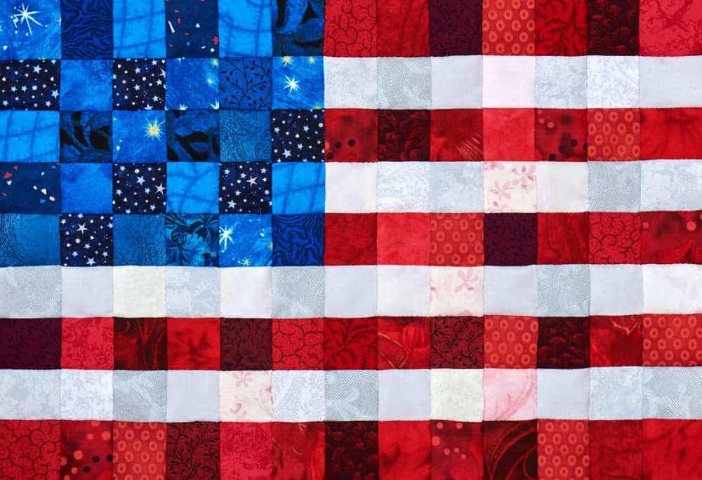 A colorful quilt in a patriotic design.