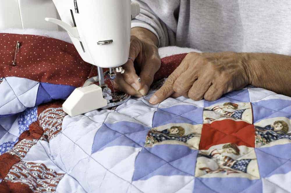 A quilt being made with a sewing machine.