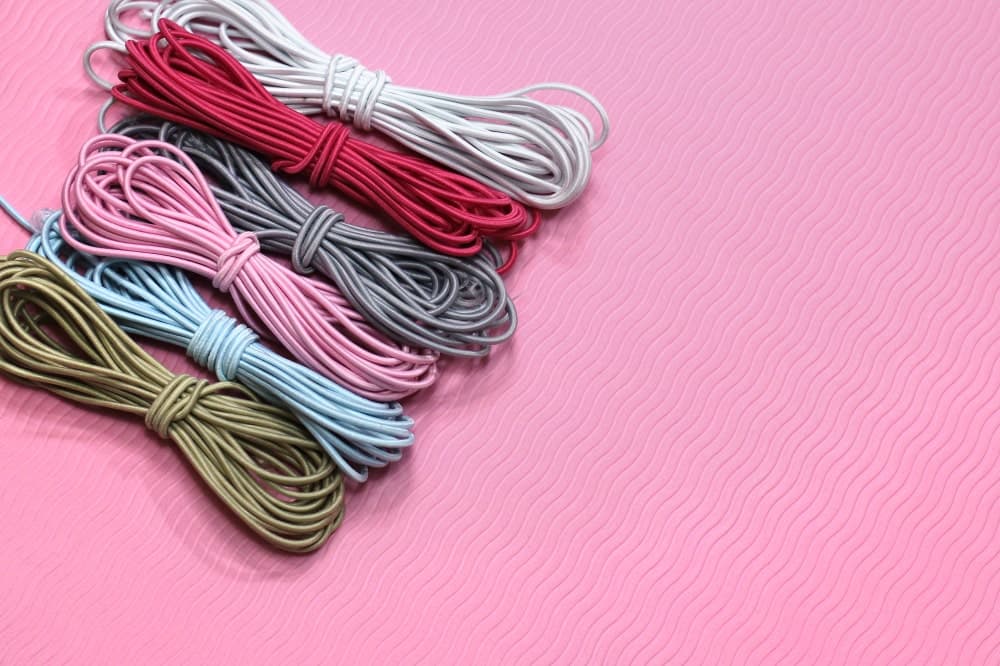A close look at rolls of colorful elastic thread.
