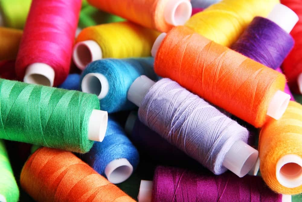 A close look at spools of colorful thread.