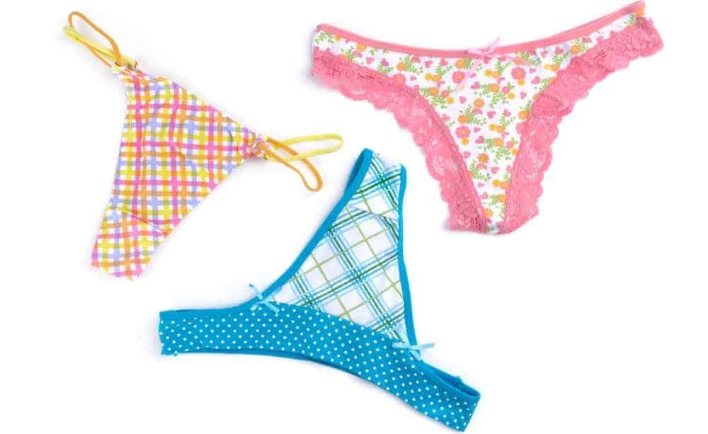 A close look at three colorful and patterned thongs.