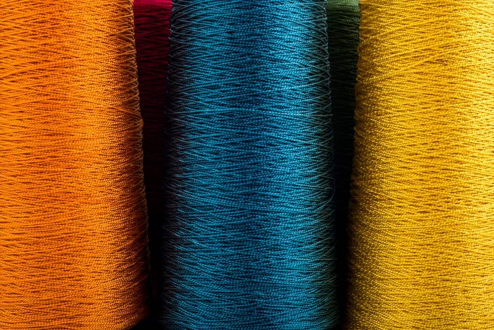 A close look at spools of rayon yarn.